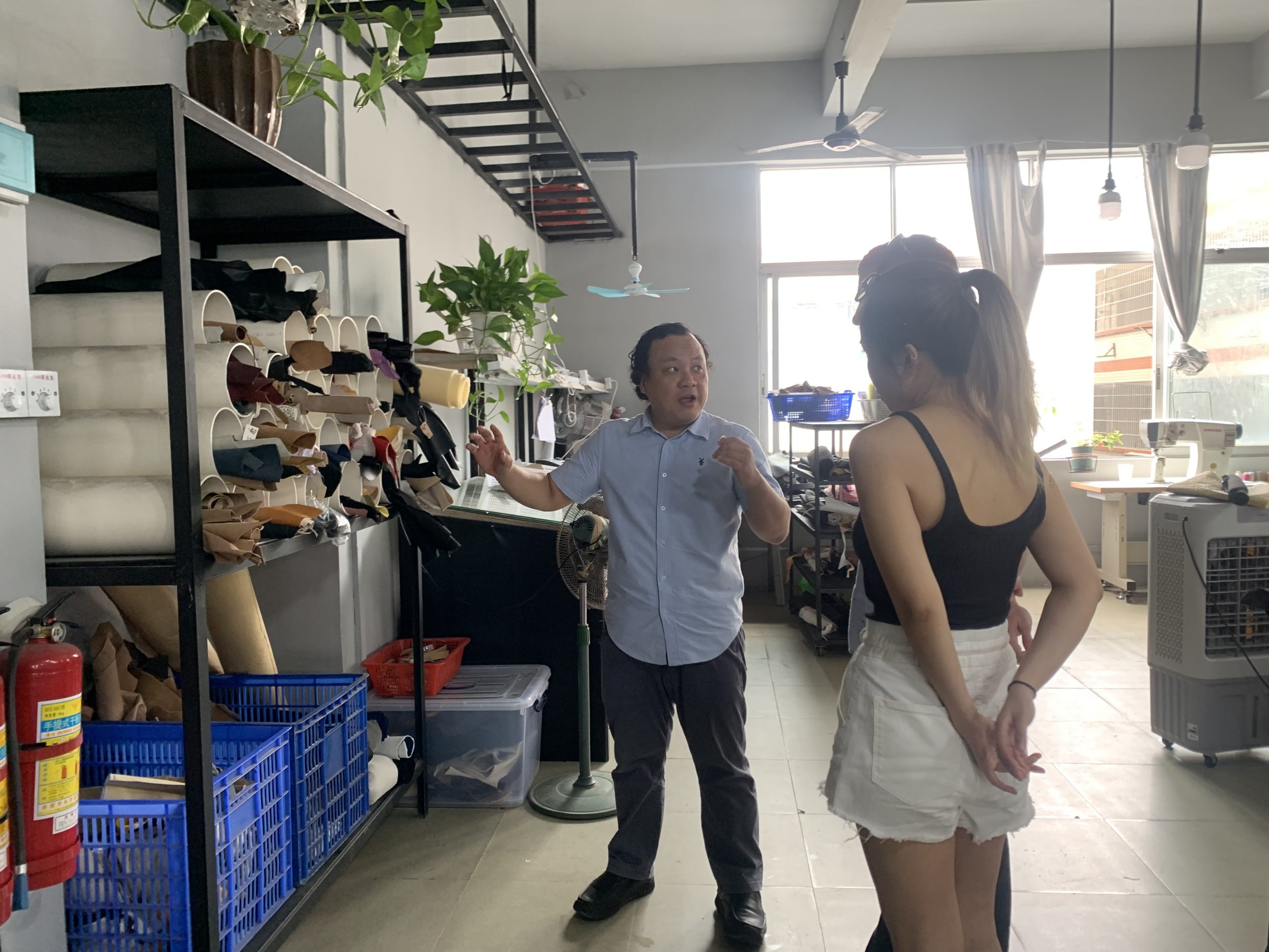 Dr SHOOZ showing customers custom shoes in Guangzhou, China